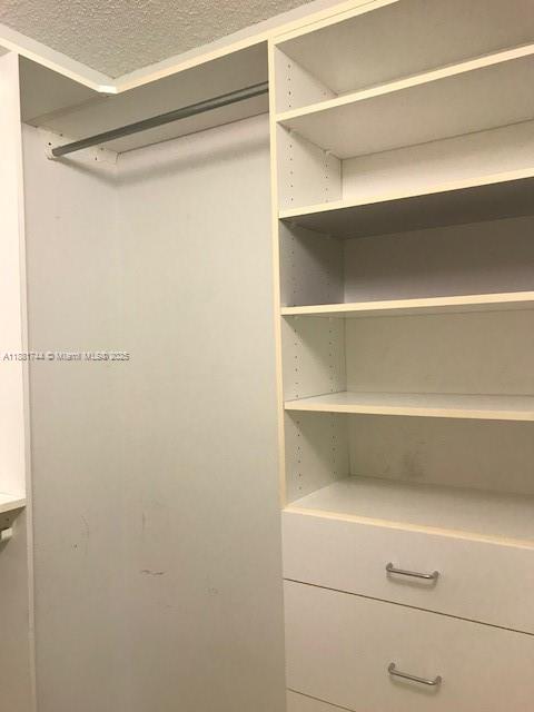 5900 Collins Avenue, Unit 1505 Miami Beach, FL 33140 - Photo 14 of 18 a view of an empty walk in closet