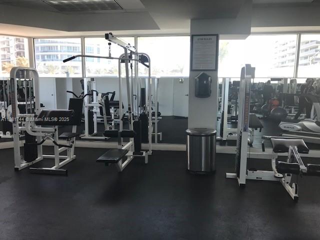 5900 Collins Avenue, Unit 1505 Miami Beach, FL 33140 - Photo 16 of 18 a view of a room with gym equipment