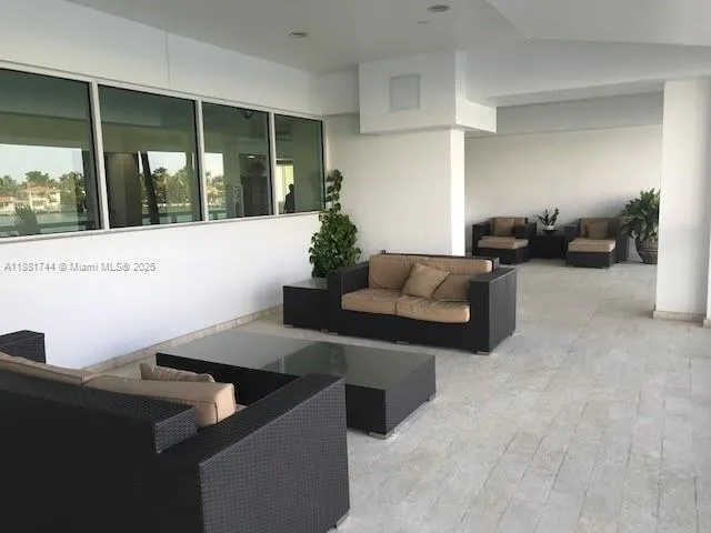 a living room with furniture and window