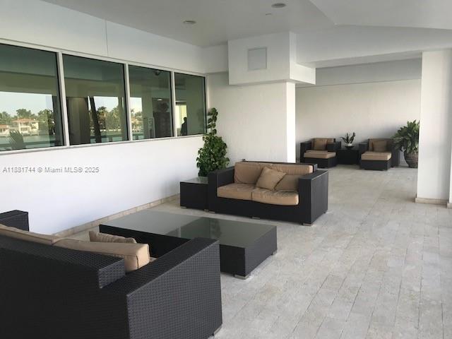 5900 Collins Avenue, Unit 1505 Miami Beach, FL 33140 - Photo 17 of 18 a living room with furniture and window