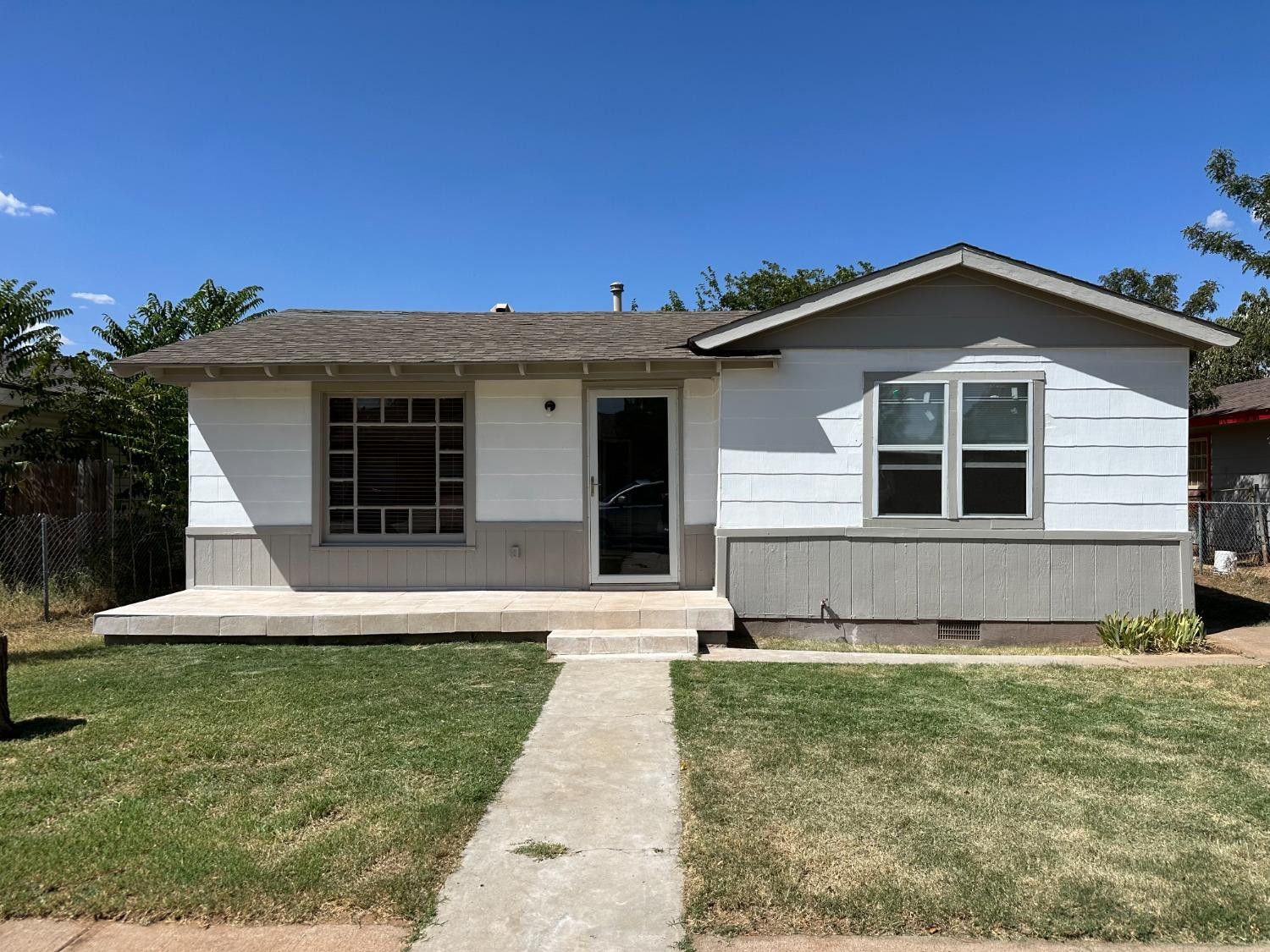 1110 46th Street Lubbock, TX 79412 - Photo 1 of 12 a front view of a house with a yard