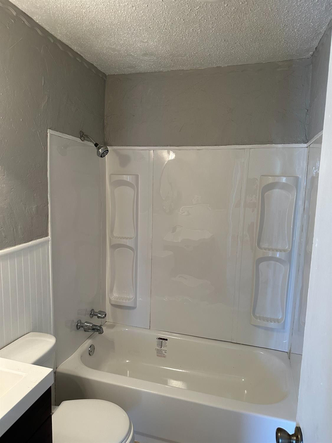 1110 46th Street Lubbock, TX 79412 - Photo 6 of 12 a bathroom with a sink and a mirror