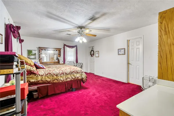 a bed room with a bed and a chandelier