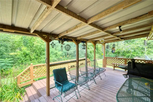 a porch and garden with furniture