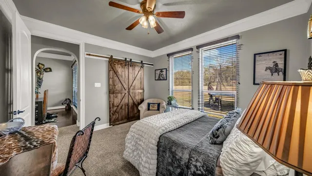 a bedroom with a bed and a couch