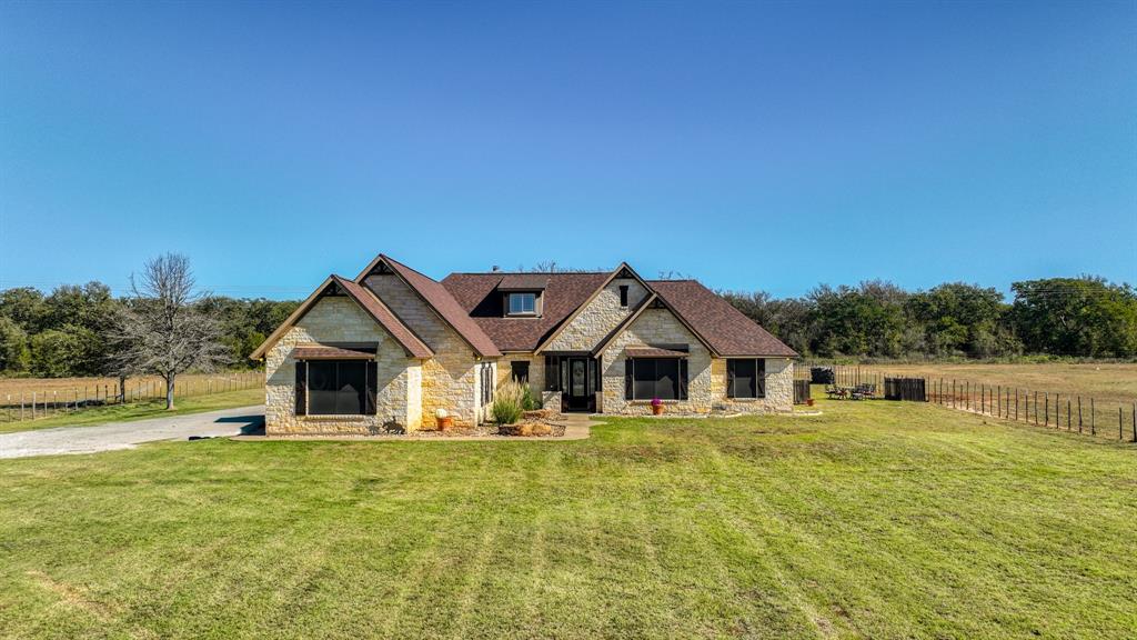 1600 Logans Run Road Perrin, TX 76486 - Photo 4 of 40 a front view of a house with garden