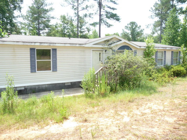 170 Walnut Creek Way Gray, GA 31032 - Photo 1 of 1 a front view of a house with garden