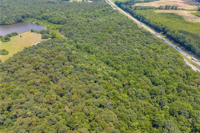 a view of a large yard with lots of green space