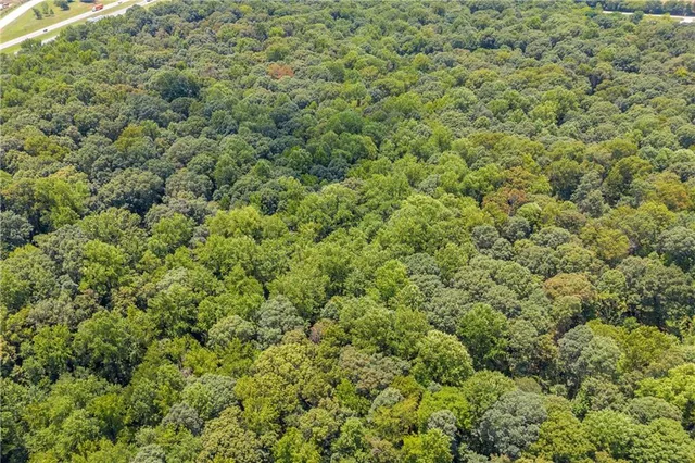 an aerial view of mountain with lake view