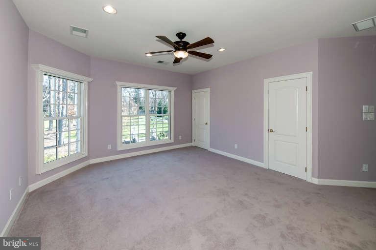 903 Georgetown Ridge Court McLean, VA 22102 - Photo 19 of 29 a view of a livingroom with a ceiling fan and window