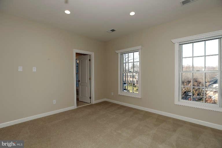 903 Georgetown Ridge Court McLean, VA 22102 - Photo 22 of 29 an empty room with windows and closet