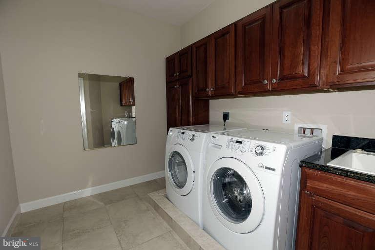 903 Georgetown Ridge Court McLean, VA 22102 - Photo 23 of 29 a utility room with dryer and washer