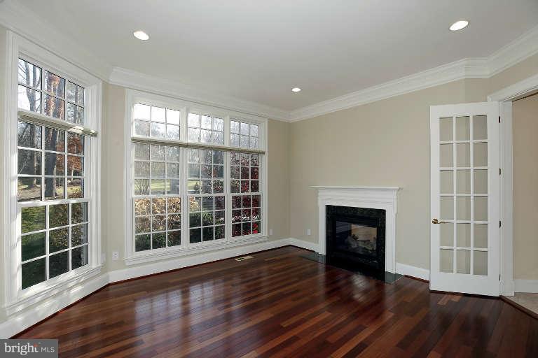 903 Georgetown Ridge Court McLean, VA 22102 - Photo 8 of 29 a view of an empty room with wooden floor and a window