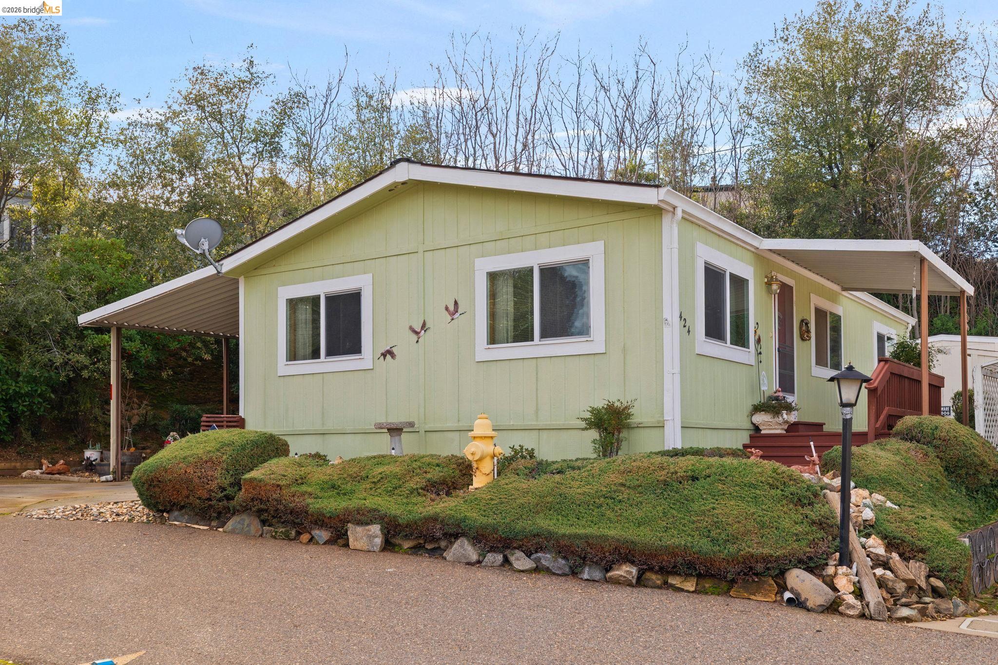 a backyard of a house with lots of green space