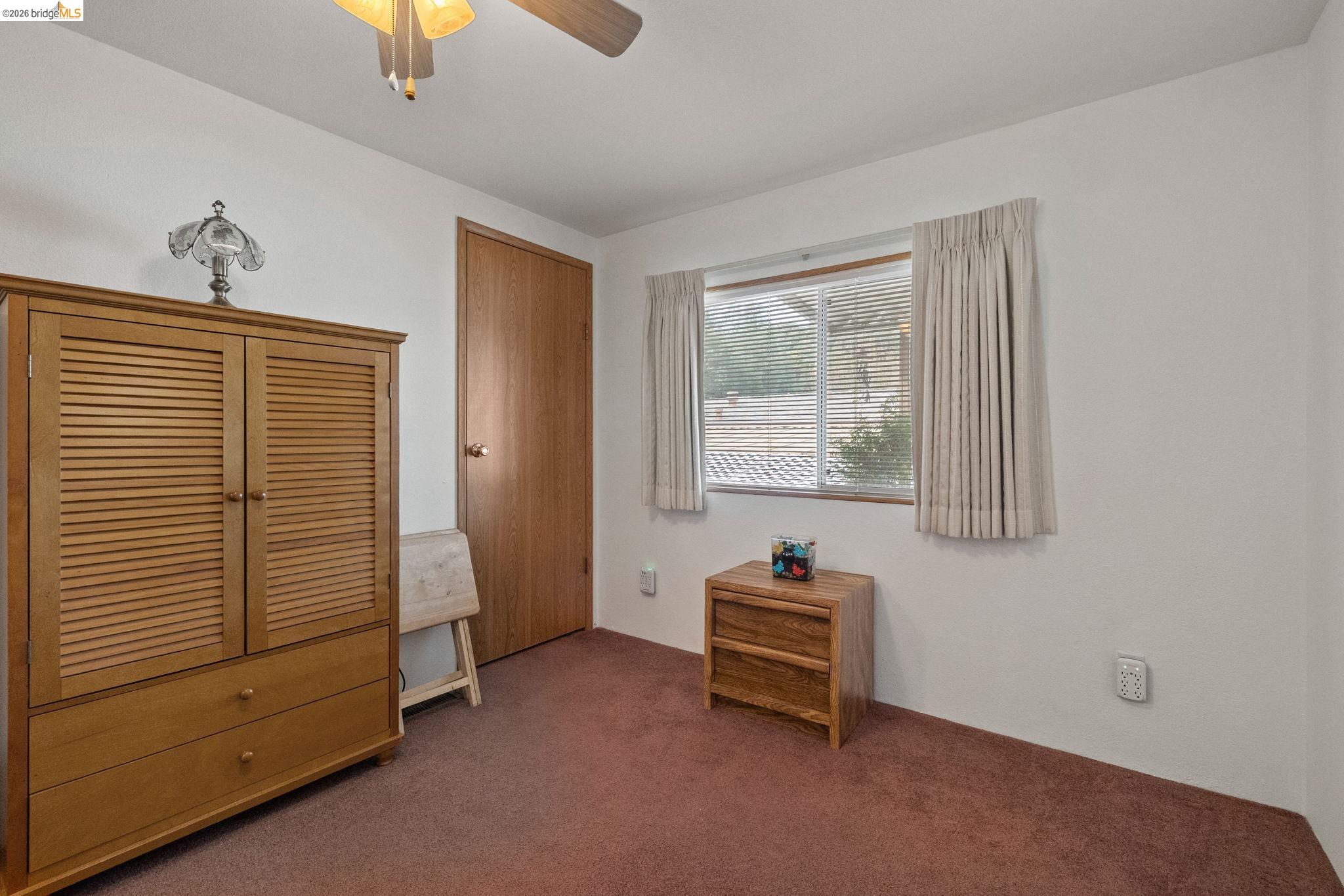 18717 Mill Villa Road, Unit 424 Jamestown, CA 95327 - Photo 16 of 29 a view of room with window and a ceiling fan