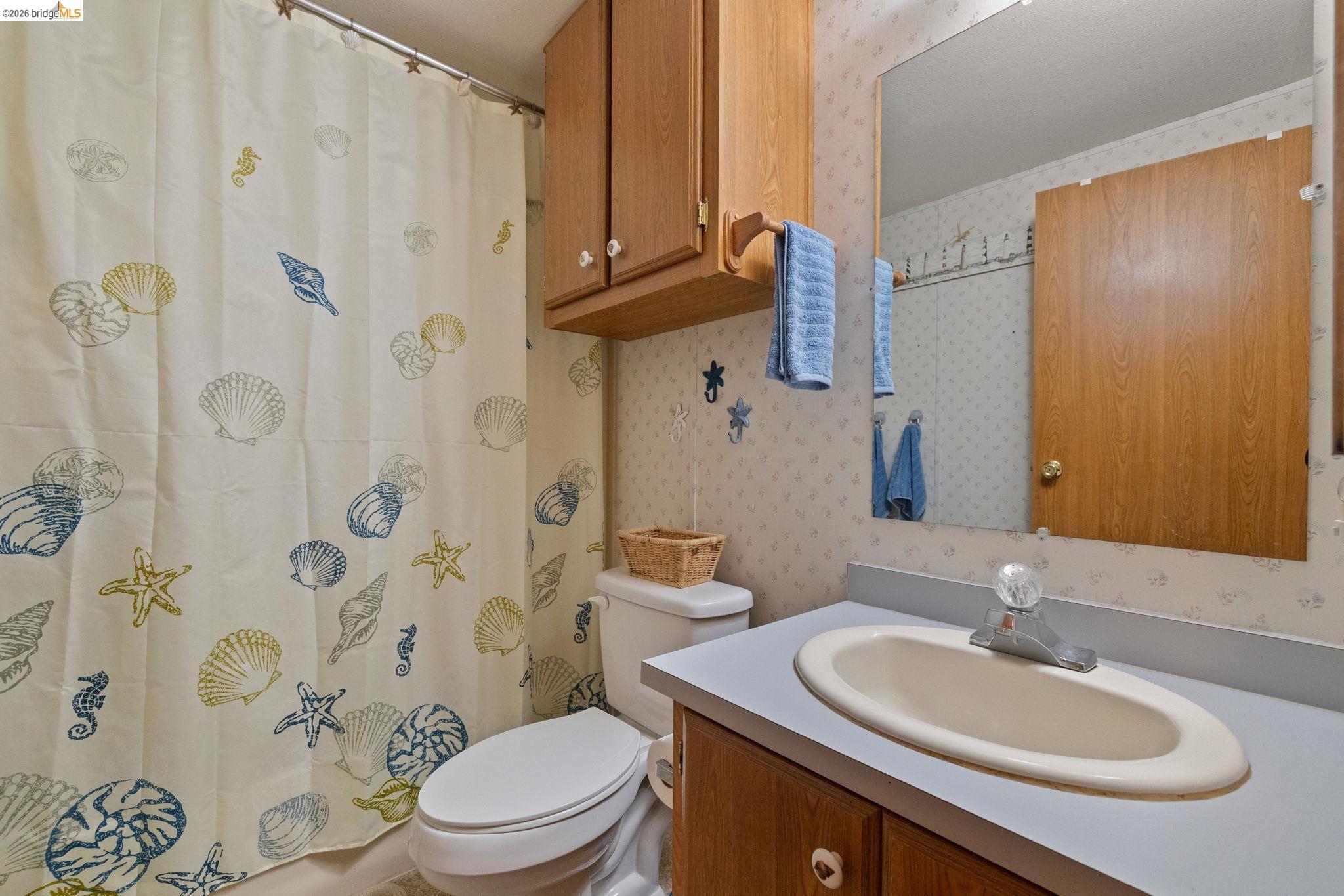 18717 Mill Villa Road, Unit 424 Jamestown, CA 95327 - Photo 17 of 29 a bathroom with a sink and toilet