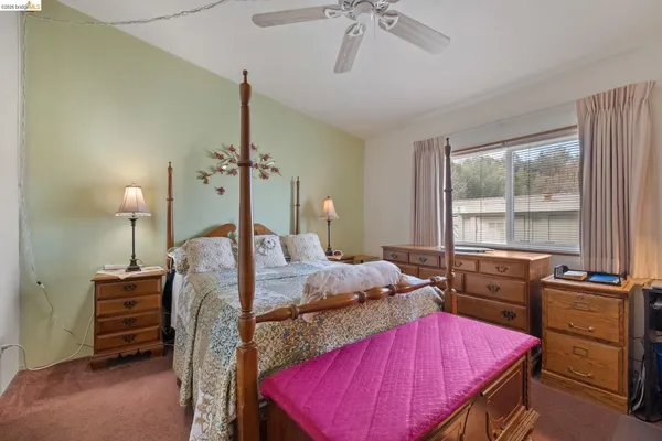 a bed room with a bed and a window