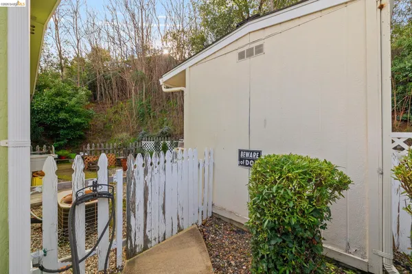 a view of a backyard with sitting area