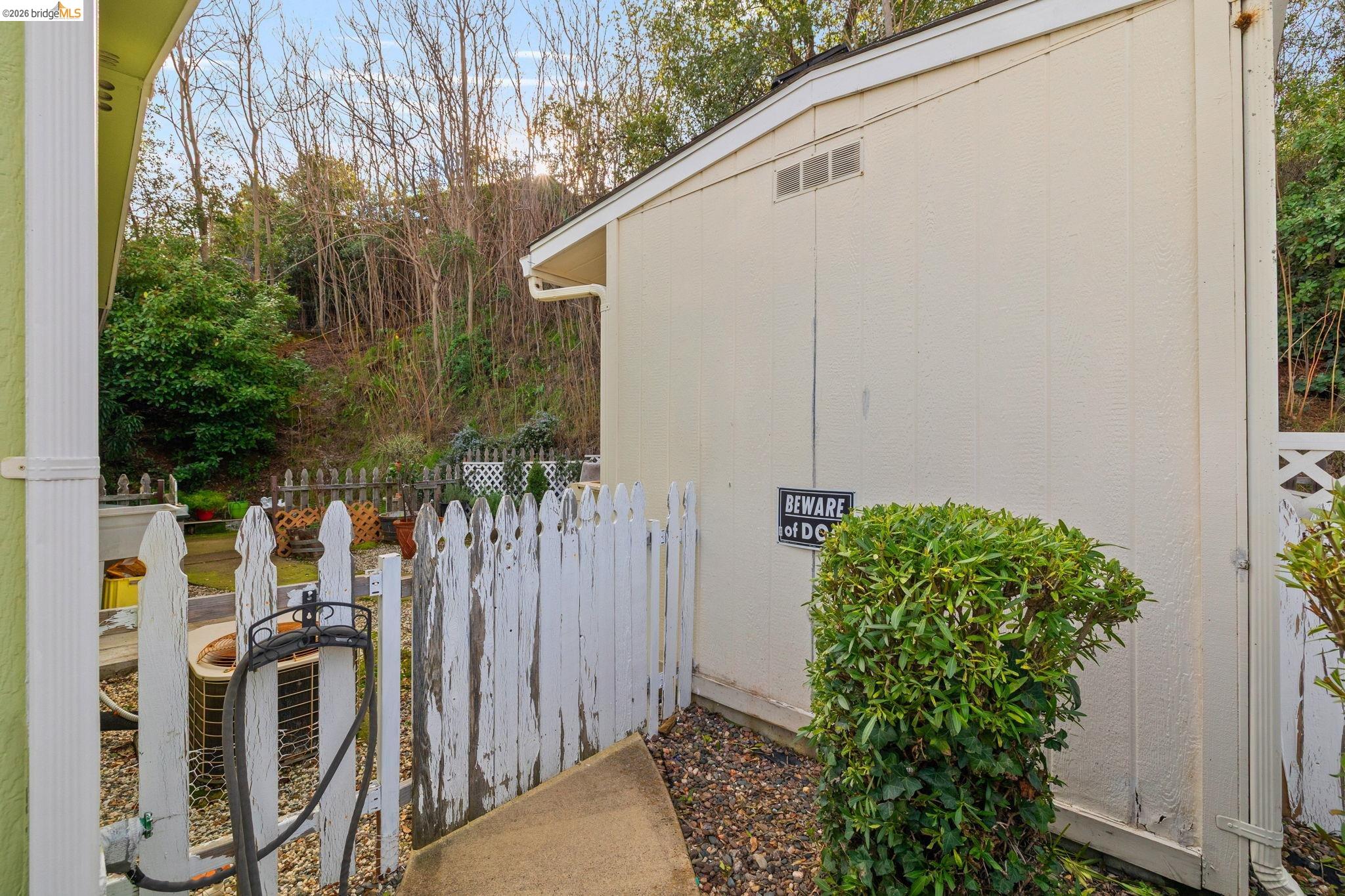 18717 Mill Villa Road, Unit 424 Jamestown, CA 95327 - Photo 24 of 29 a backyard of a house with a garden and plants