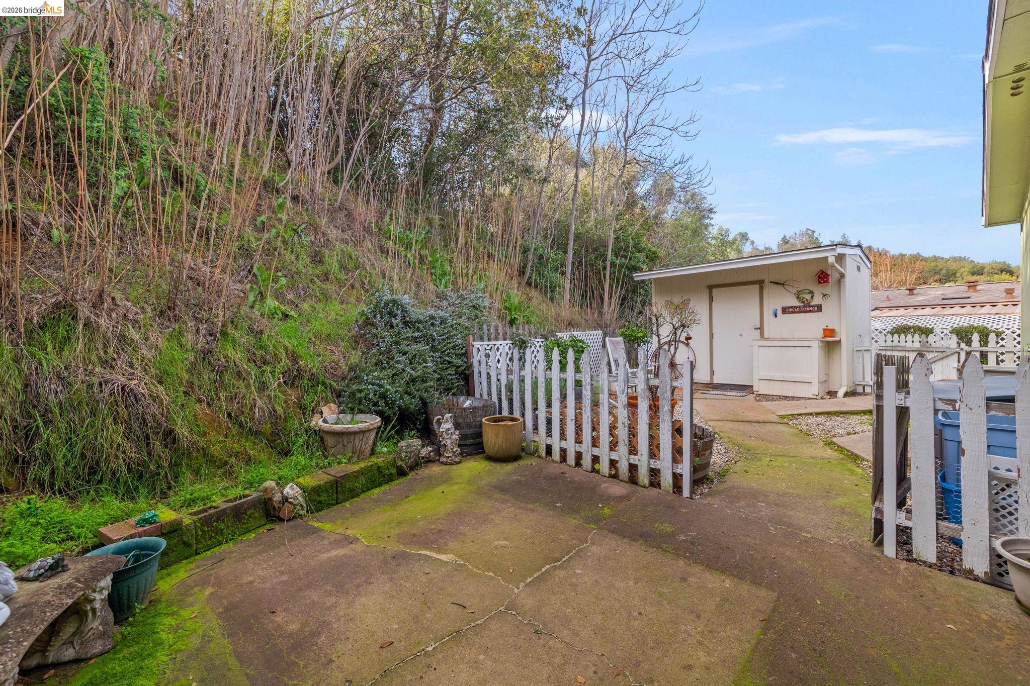 18717 Mill Villa Road, Unit 424 Jamestown, CA 95327 - Photo 27 of 29 a view of a house with a wooden fence
