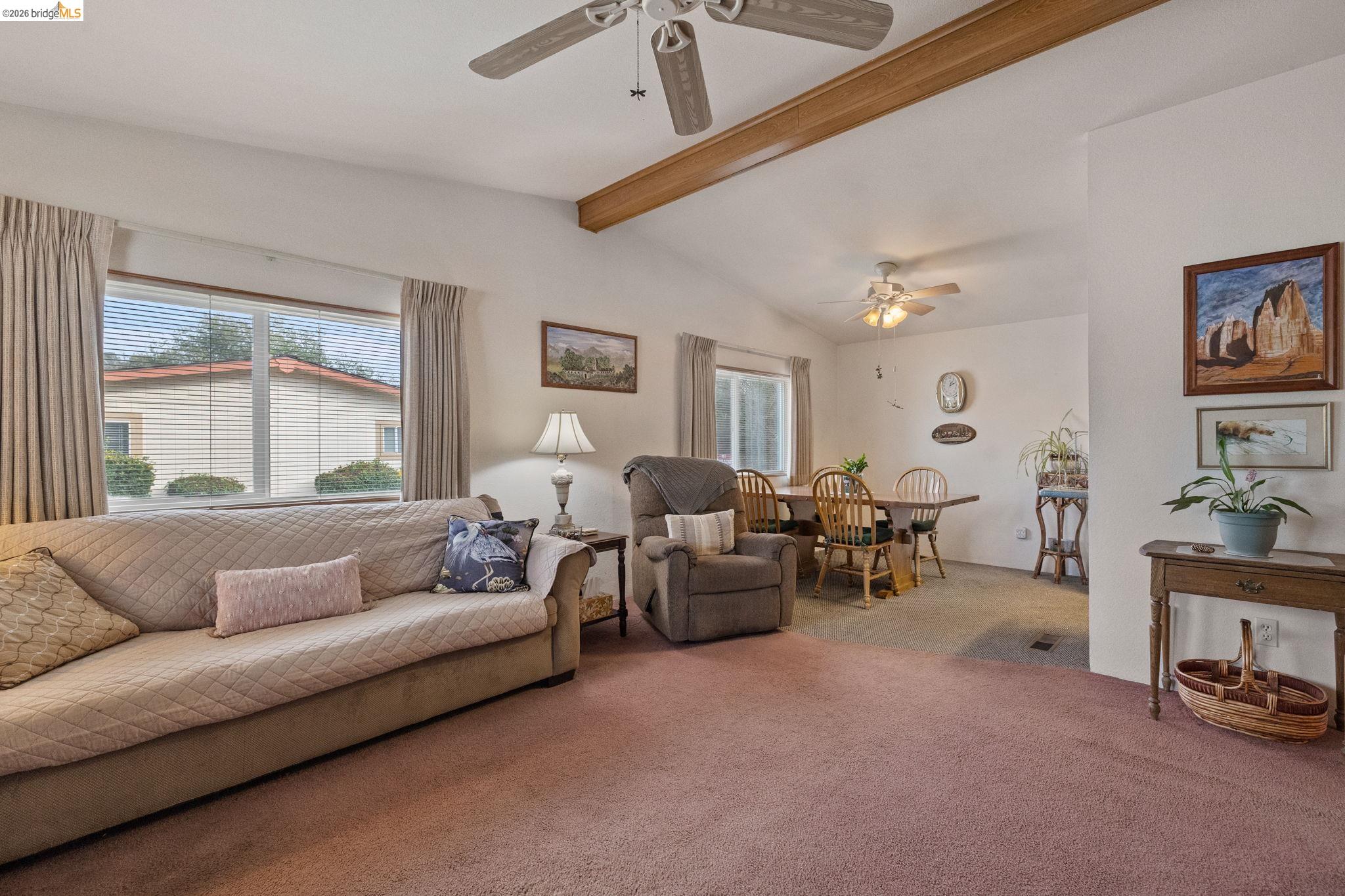 18717 Mill Villa Road, Unit 424 Jamestown, CA 95327 - Photo 5 of 29 a living room with furniture and a large window