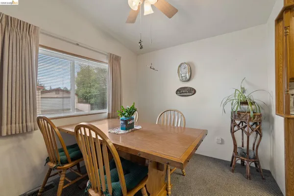 a view of a dining room with furniture window and outside view