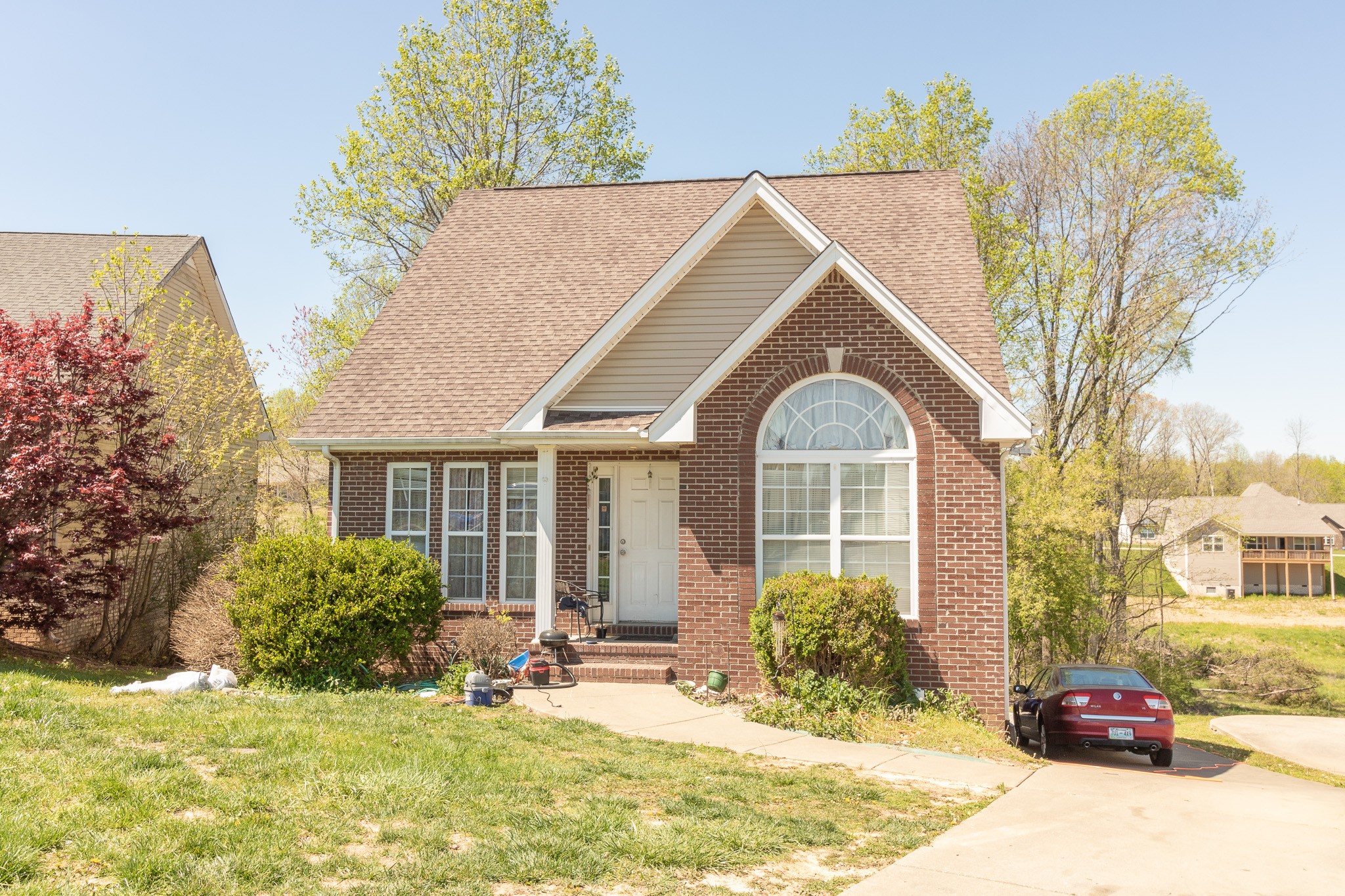 a front view of a house with garden