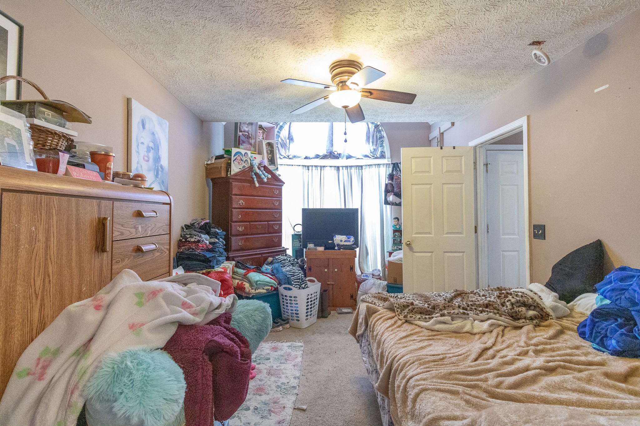 479 Berry Circle Springfield, TN 37172 - Photo 12 of 27 a bedroom with bed and a chandelier