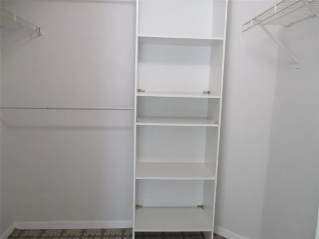 a view of an empty walk in closet