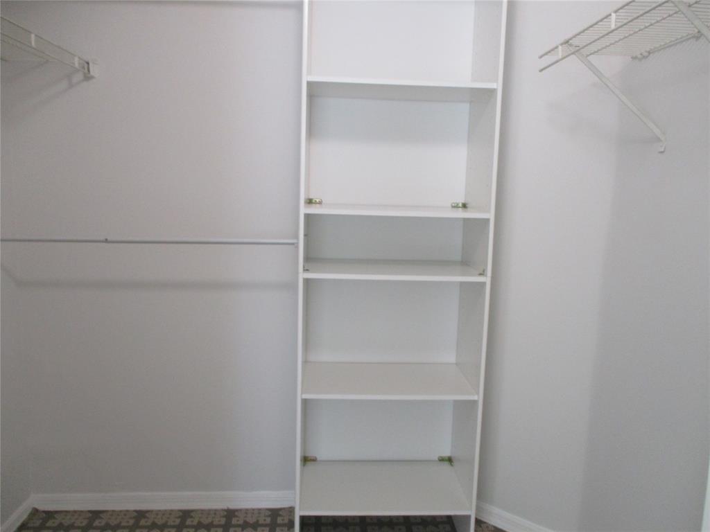 5045 Wiles Road, Unit 206 Coconut Creek, FL 33073 - Photo 14 of 24 a view of an empty walk in closet