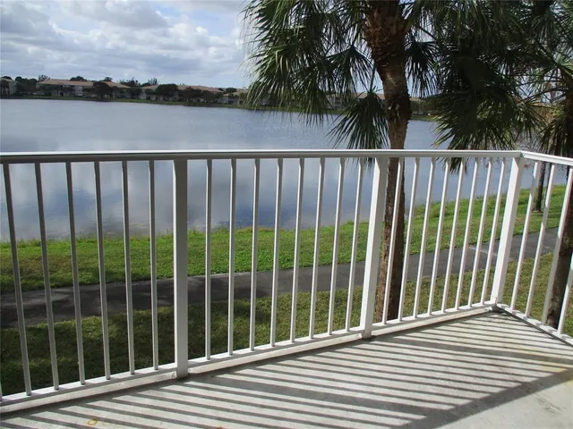 a view of a lake with a big yard