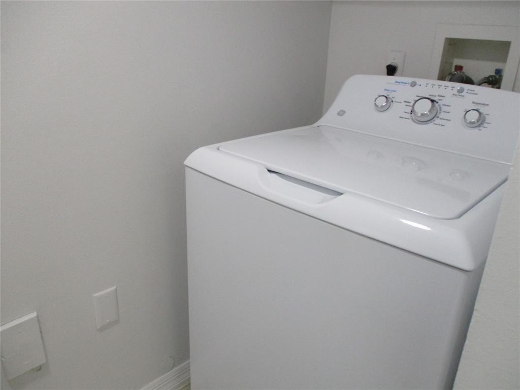 5045 Wiles Road, Unit 206 Coconut Creek, FL 33073 - Photo 5 of 24 a utility room with dryer and washer