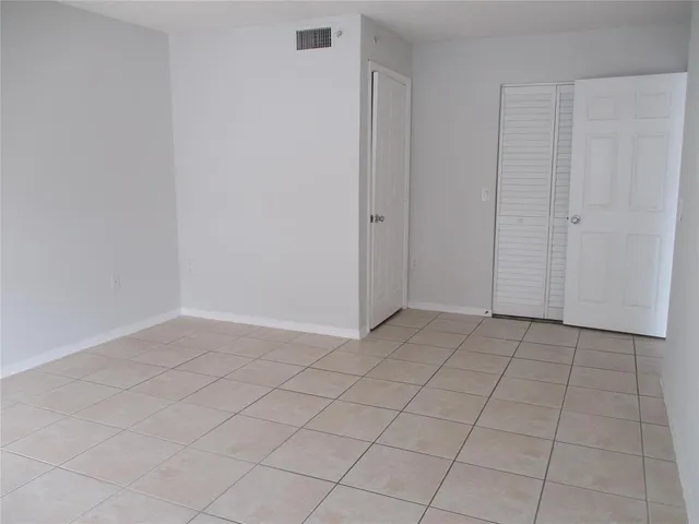 an empty room with cabinet