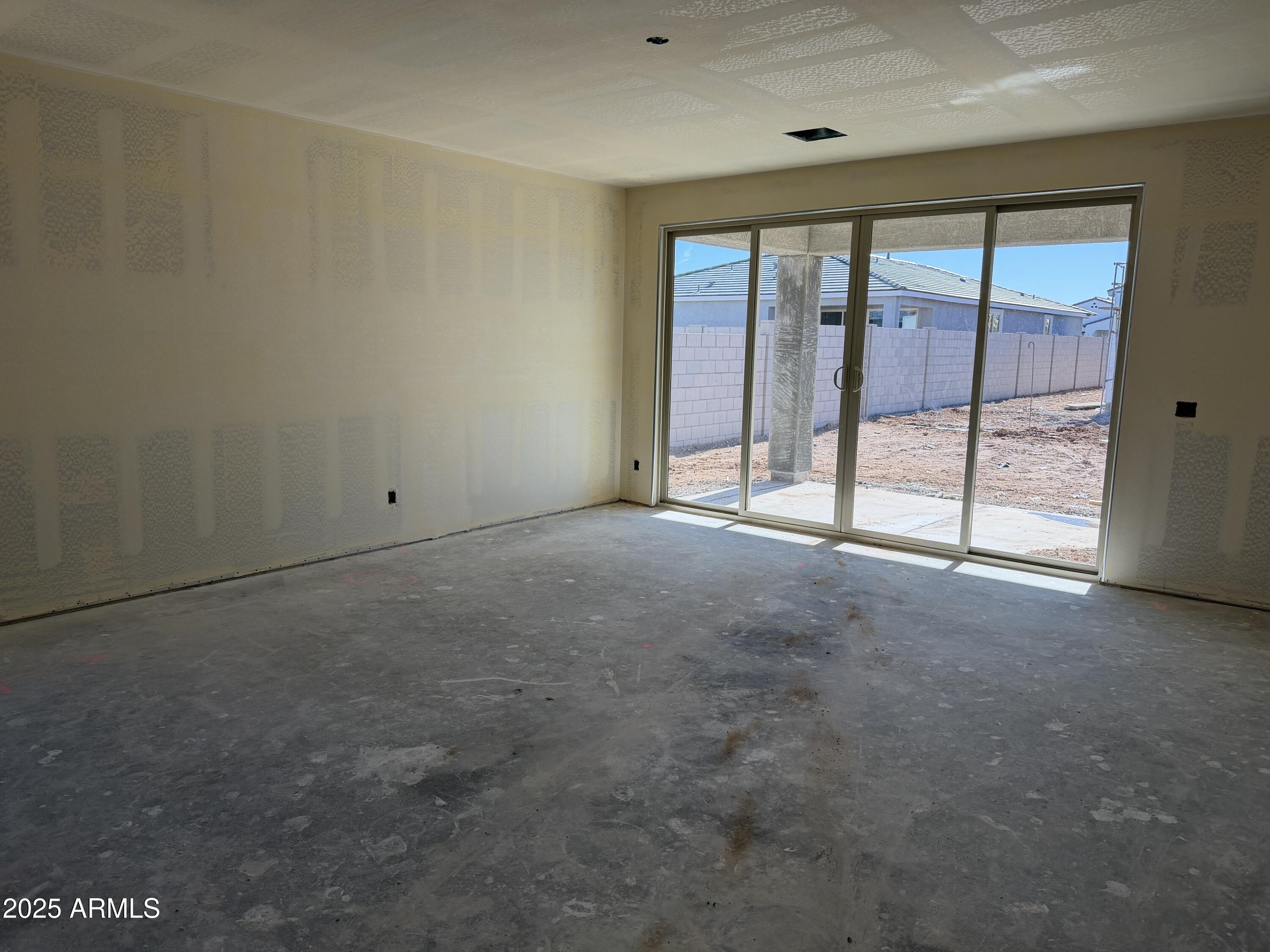 5539 West Piedmont Road Laveen, AZ 85339 - Photo 7 of 26 a view of an empty room with a window