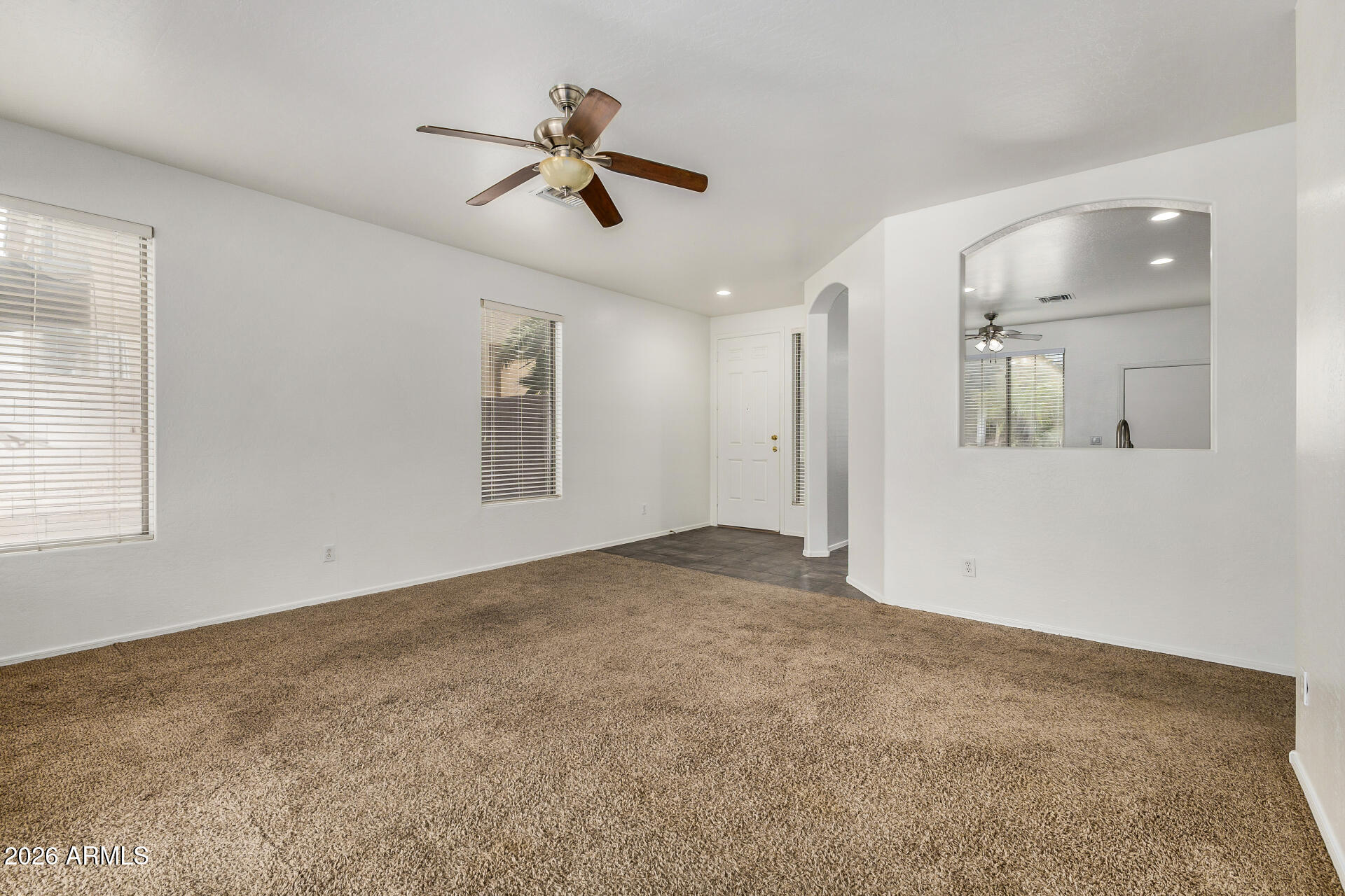 4314 East Megan Street Gilbert, AZ 85295 - Photo 13 of 31 a view of a livingroom with a ceiling fan and window