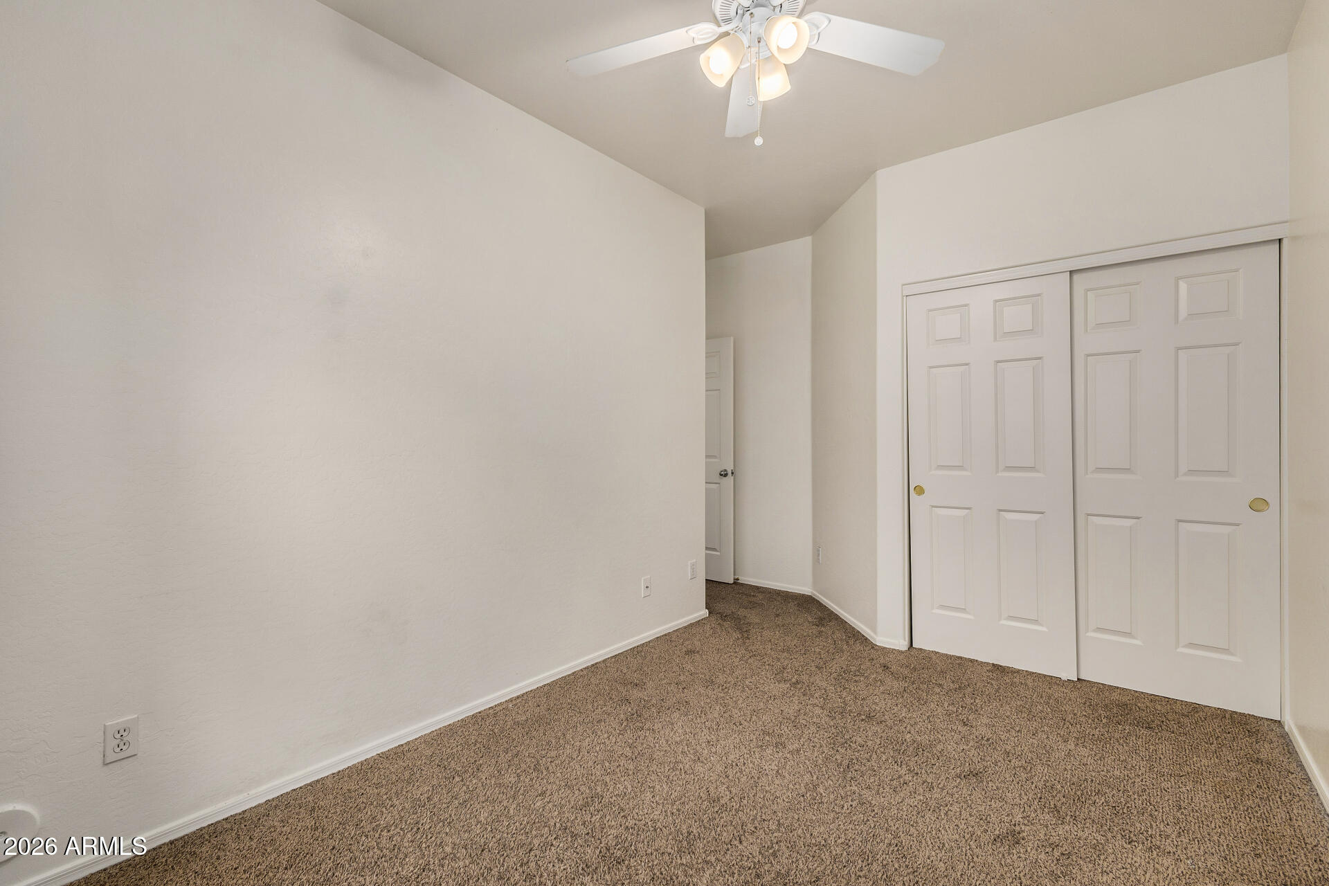 4314 East Megan Street Gilbert, AZ 85295 - Photo 16 of 31 an empty room with a chandelier fan