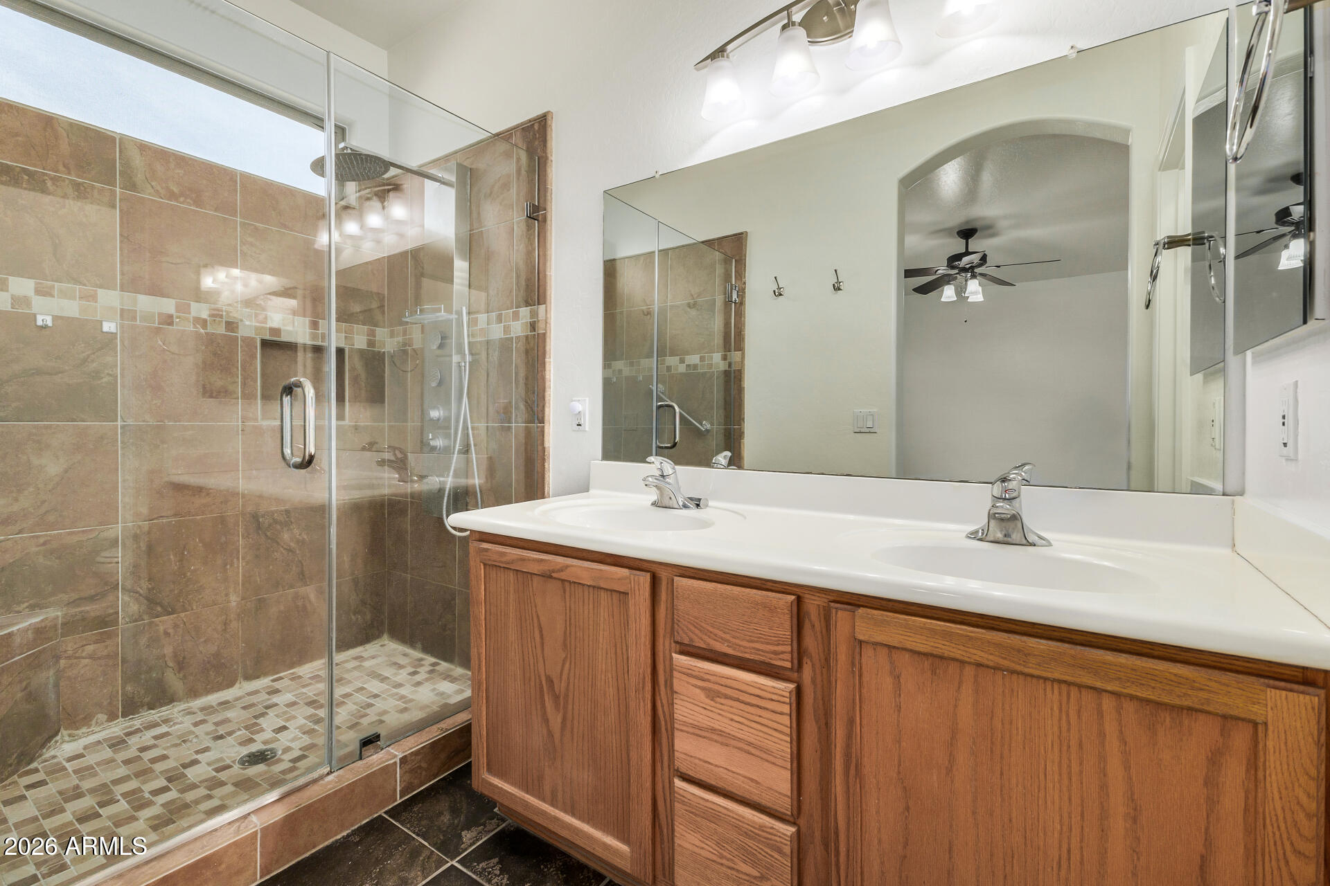 4314 East Megan Street Gilbert, AZ 85295 - Photo 17 of 31 a bathroom with a sink and a mirror