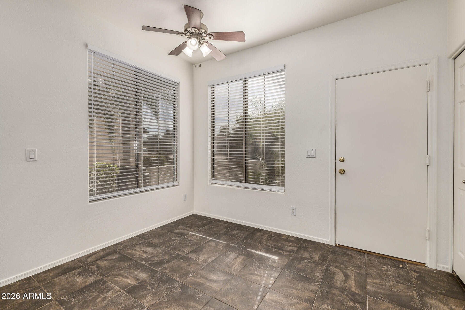 4314 East Megan Street Gilbert, AZ 85295 - Photo 19 of 31 a view of an empty room with a window