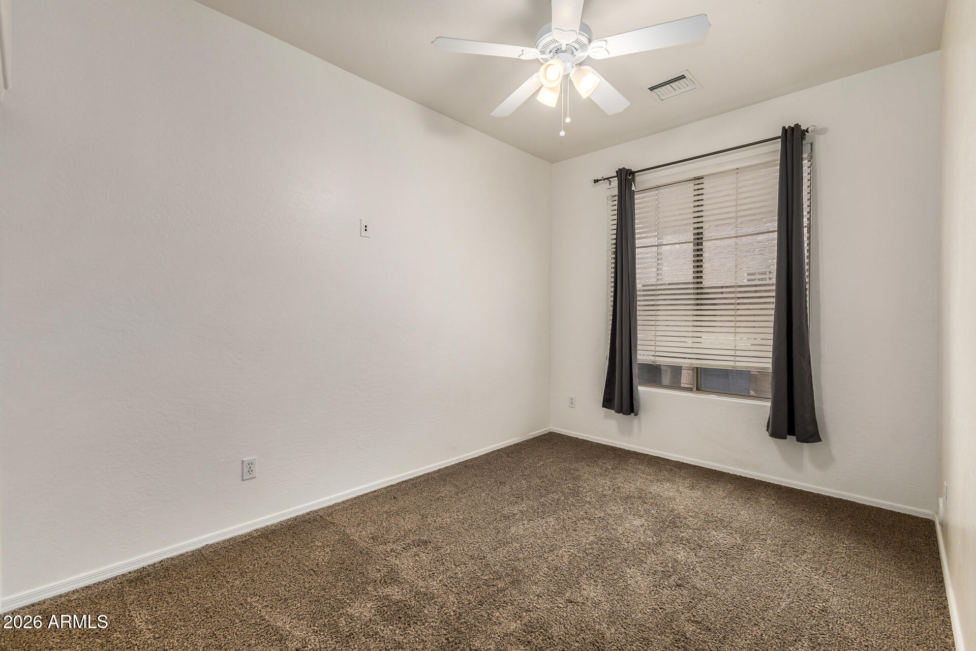4314 East Megan Street Gilbert, AZ 85295 - Photo 21 of 31 an empty room with chandelier fan