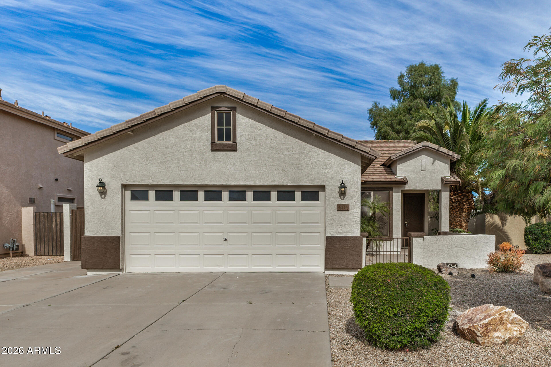 4314 East Megan Street Gilbert, AZ 85295 - Photo 28 of 31 a front view of a house with a yard