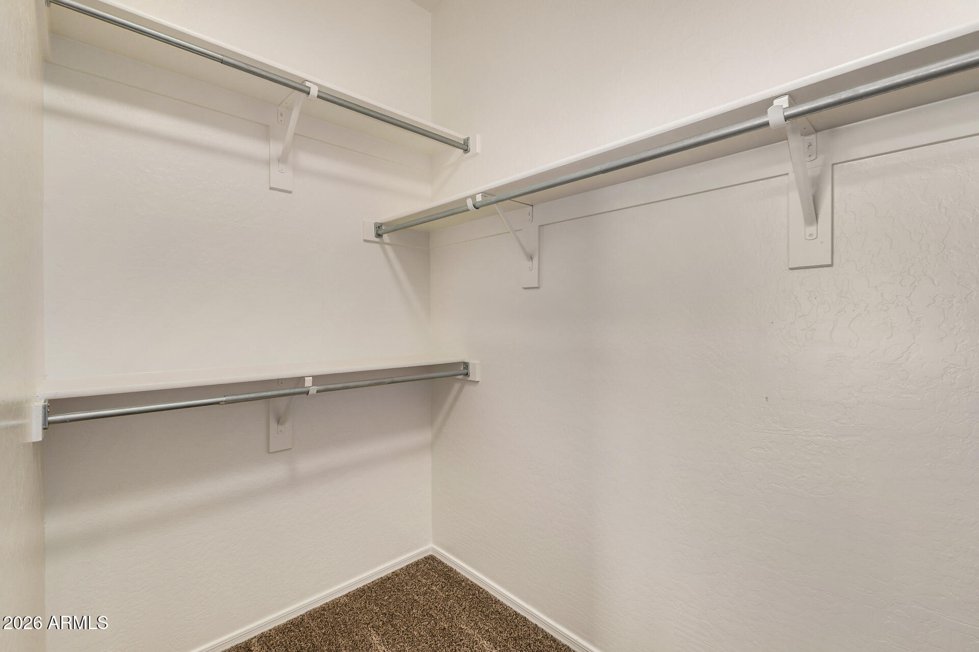 4314 East Megan Street Gilbert, AZ 85295 - Photo 31 of 31 a view of a room with racks on the wall