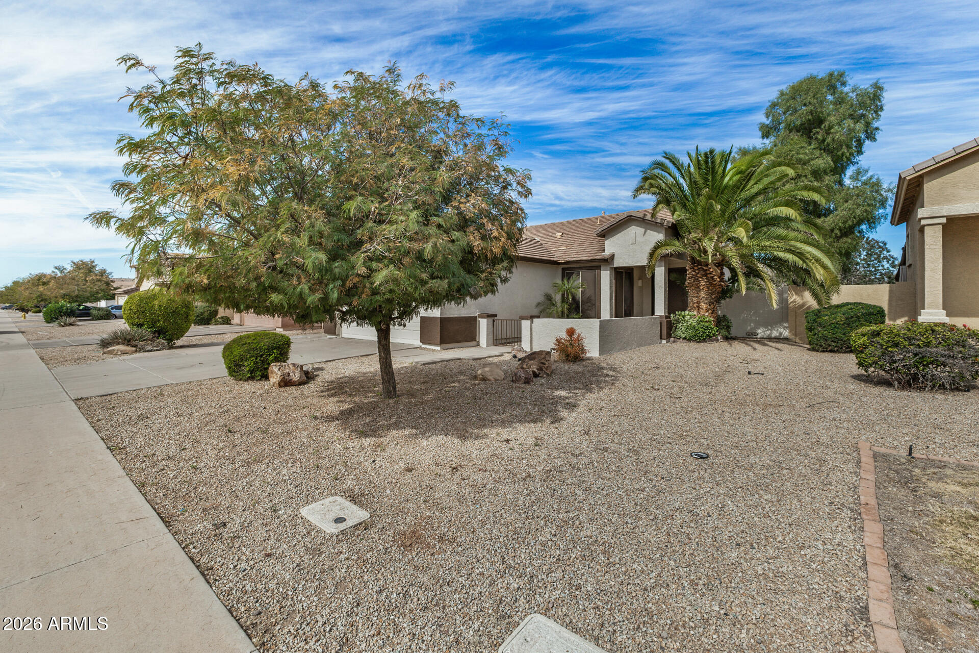 4314 East Megan Street Gilbert, AZ 85295 - Photo 5 of 31 front view of a house with a yard