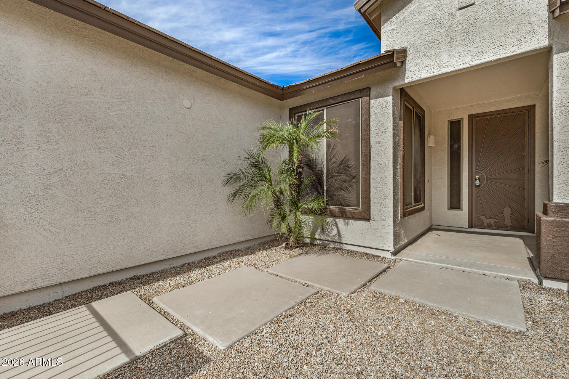 4314 East Megan Street Gilbert, AZ 85295 - Photo 6 of 31 a backyard of a house with potted plants