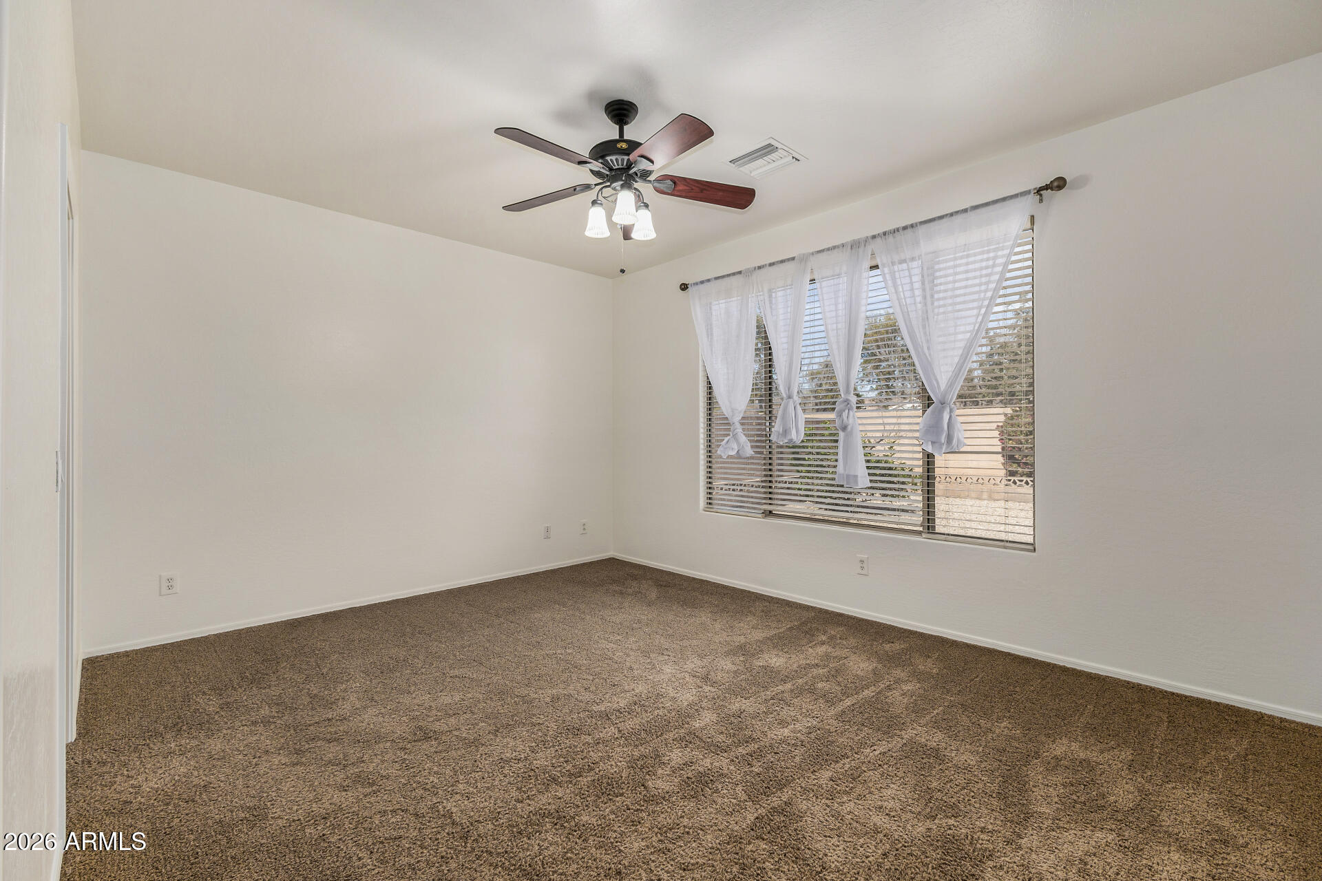 4314 East Megan Street Gilbert, AZ 85295 - Photo 8 of 31 a view of an empty room with a window