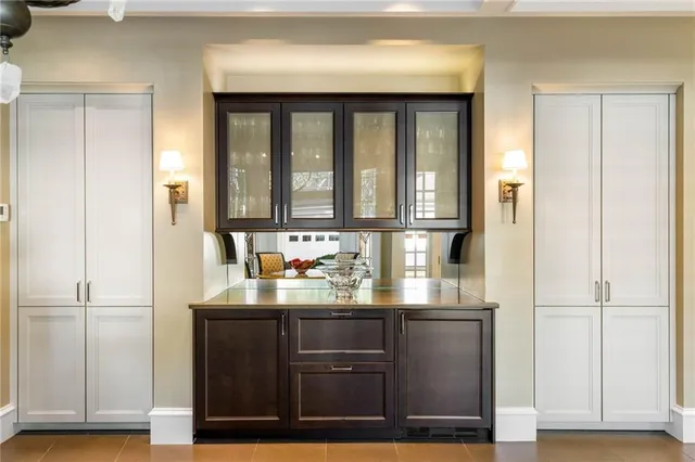 a kitchen with a refrigerator and cabinets