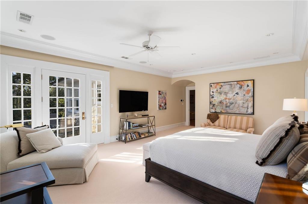 81 Peachtree Circle Northeast Atlanta, GA 30309 - Photo 22 of 54 a bedroom with furniture and a flat screen tv