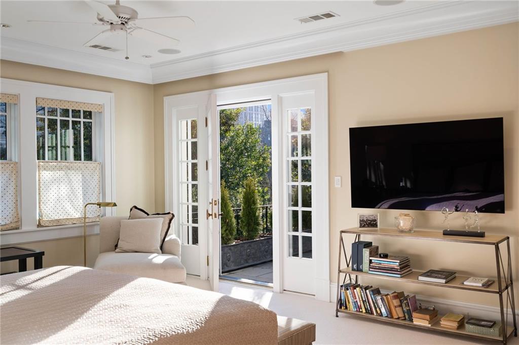 81 Peachtree Circle Northeast Atlanta, GA 30309 - Photo 23 of 54 a bedroom with furniture and a flat screen tv