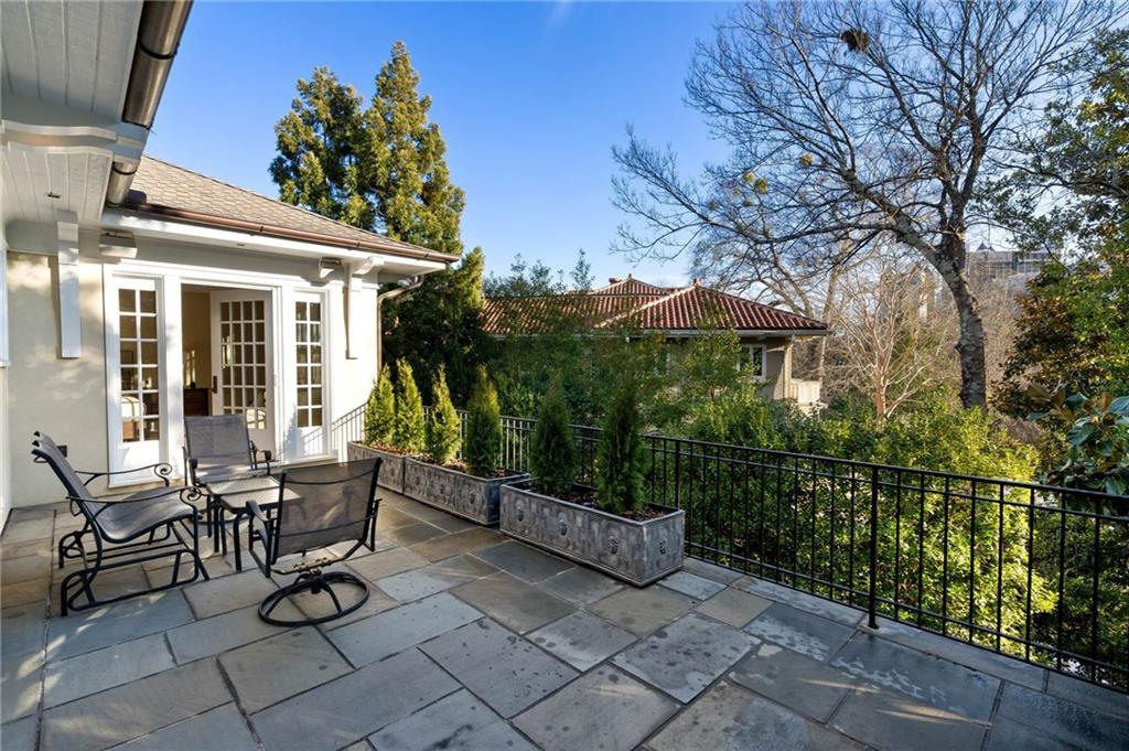 81 Peachtree Circle Northeast Atlanta, GA 30309 - Photo 24 of 54 a view of a patio with iron fence