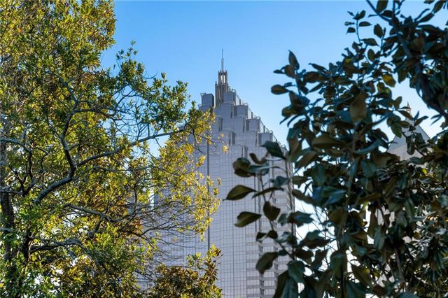 a large white kitchen with a large window