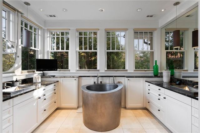 a bathroom with a tub and shower